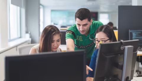 Students reviewing progress on the latest project. 